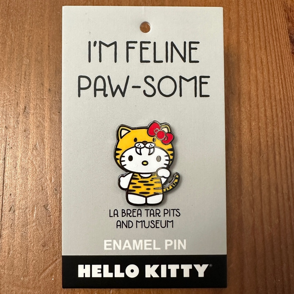 Limited Edition La Brea Tar Pits Hello Kitty Saber Toothed Tiger Cat Enamel Pin